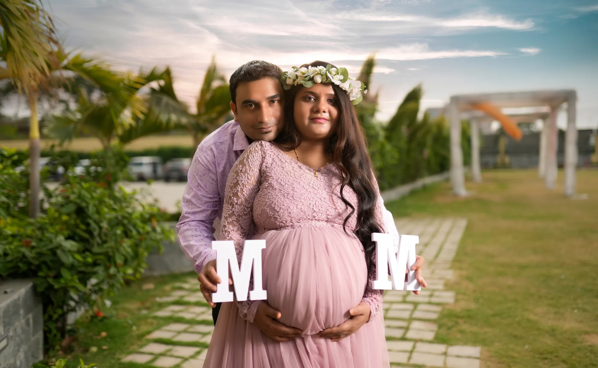 Expecting couple holding M and M letters
