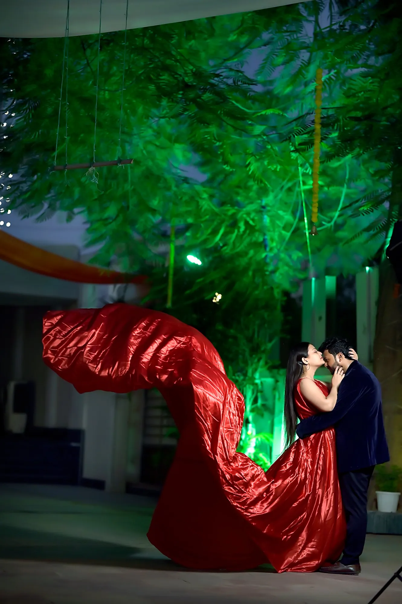 Pre-wedding shoot at night with a flying red gown